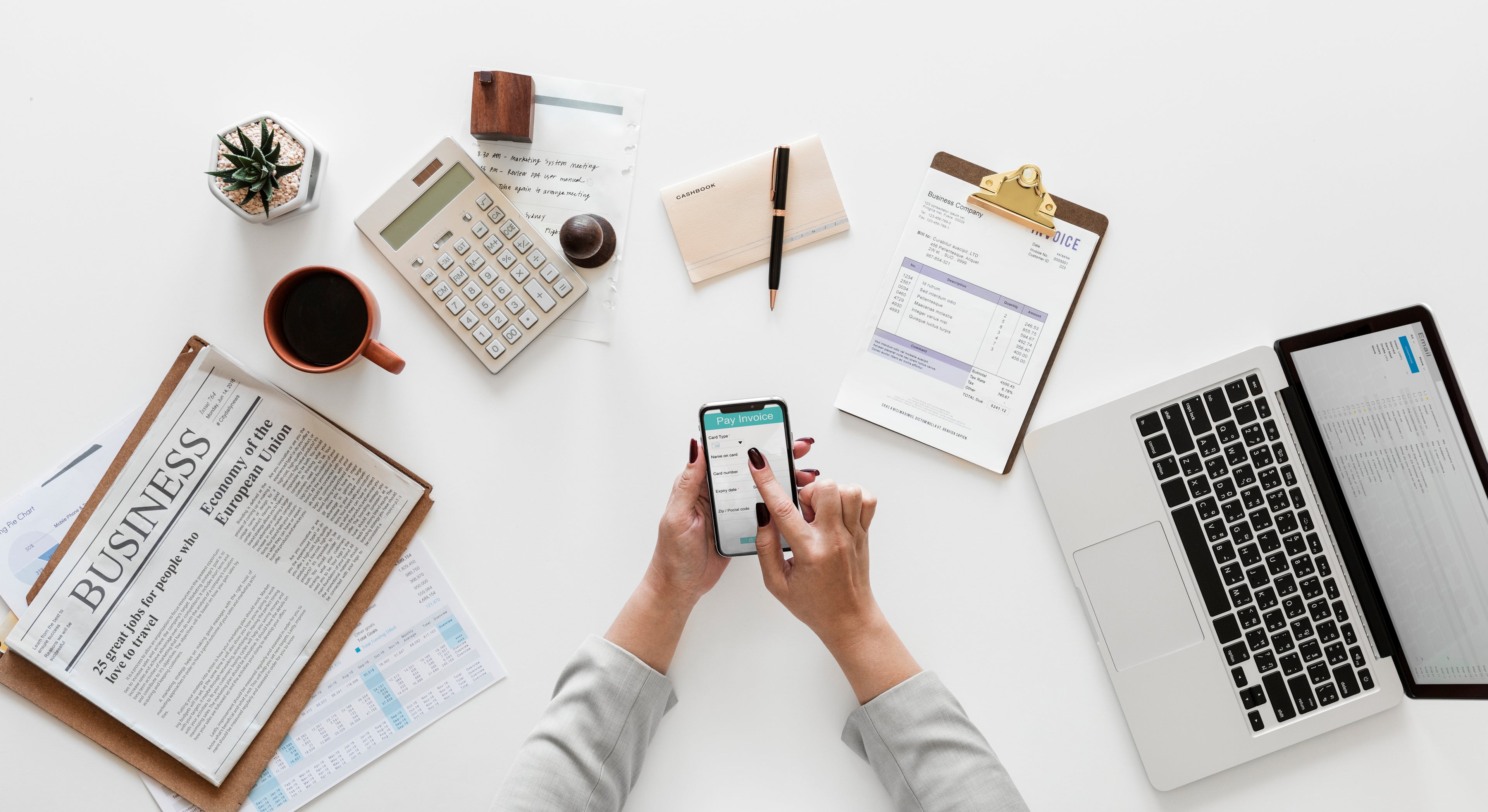 Top view of a busy professional working on laptop and documents
Business workspace with invoice, coffee, and digital devices
Organized office desk for e-commerce and online trading