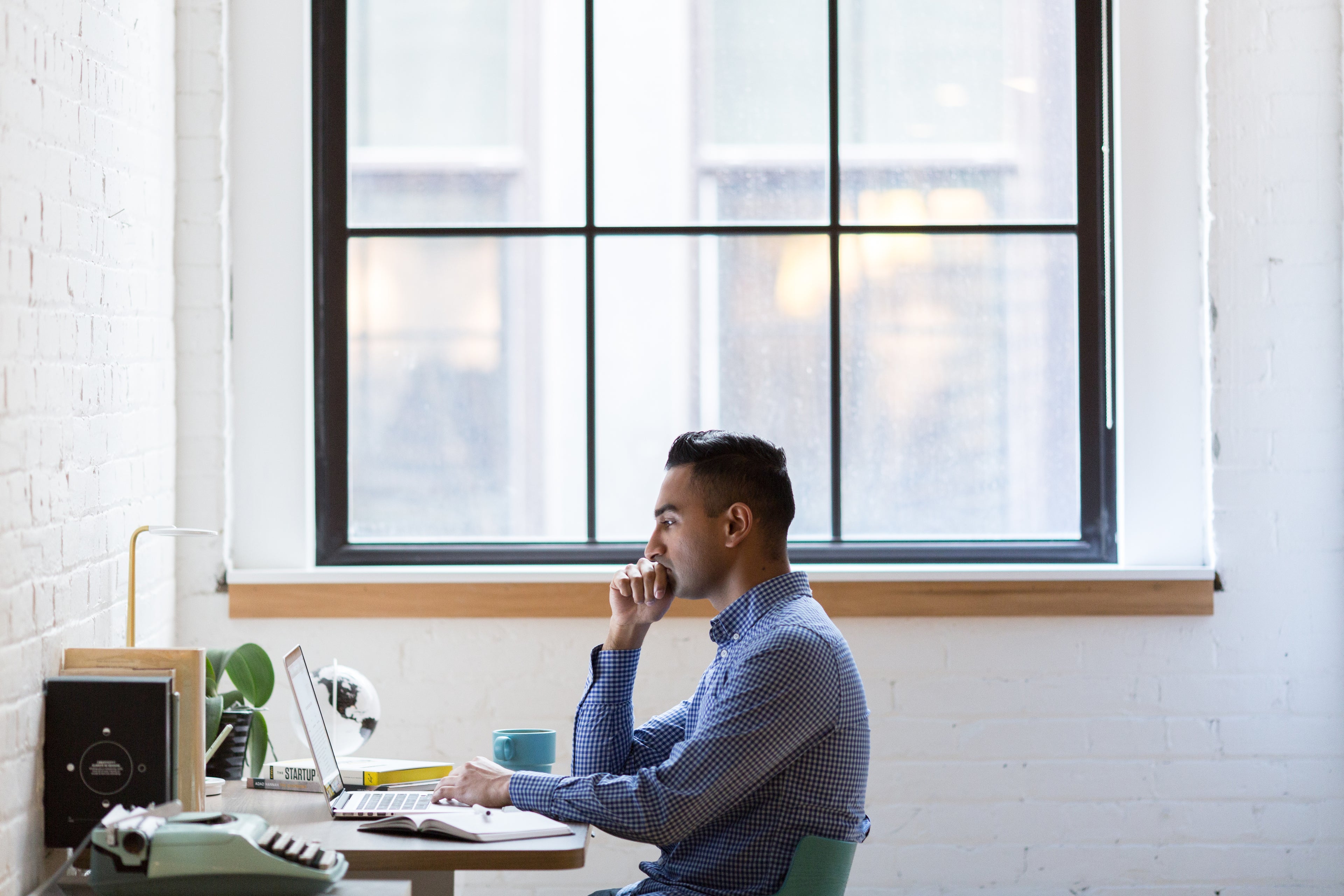 Professional sourcing agent working diligently on product research and negotiation
Focused team analyzing market trends in a modern office environment
Creative workspace for developing innovative supply chain solutions